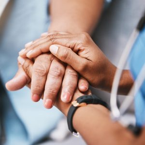 Empathy, trust and nurse holding hands with patient for help, consulting support and healthcare advice. Kindness, counseling and medical therapy in nursing home for hope, consultation and psychology