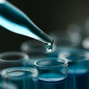 Test tube of glass overflows liquid solution potassium
