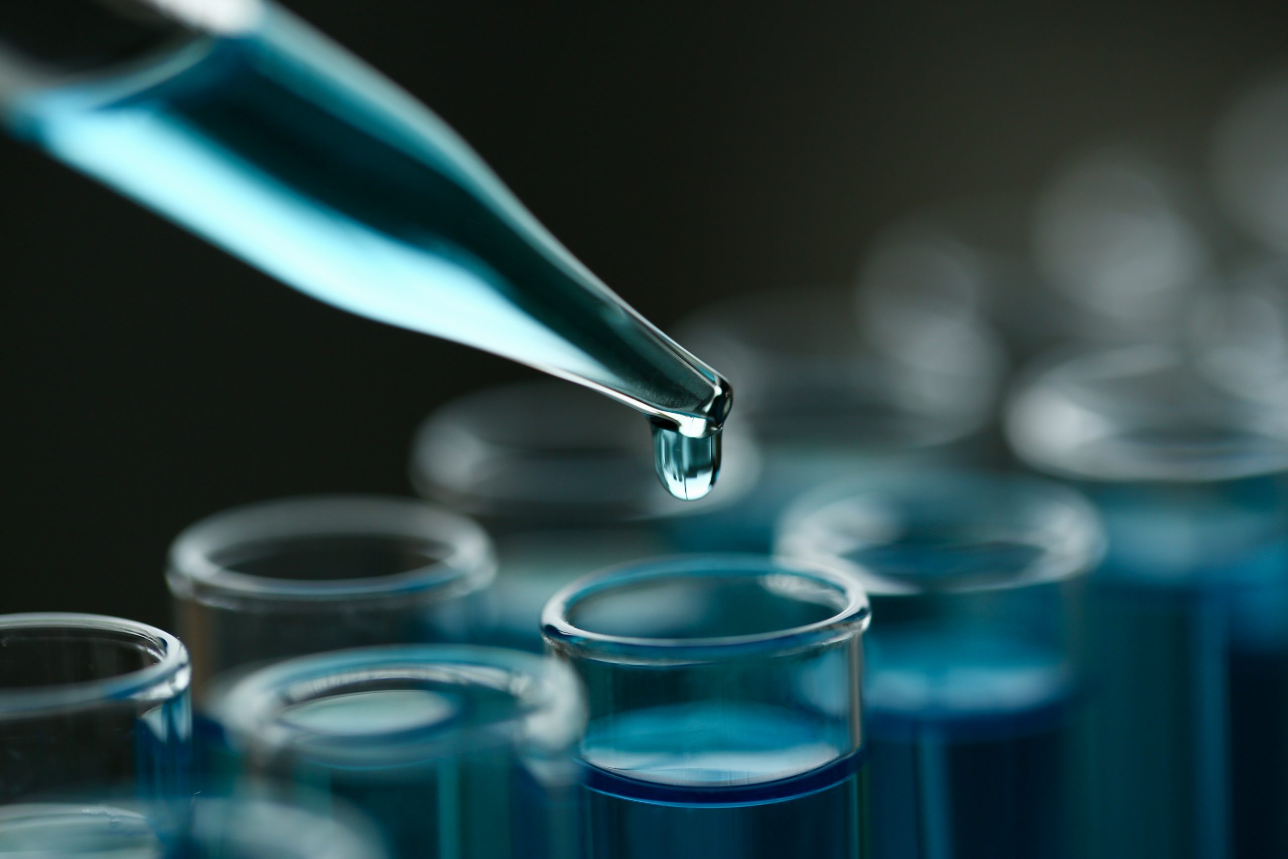 Test tube of glass overflows liquid solution potassium