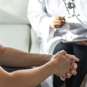 Men’s health disease, on prostate cancer or mental illness concept with male patient having consultation with doctor or psychiatrist working on diagnostic examination in medical clinic or hospital