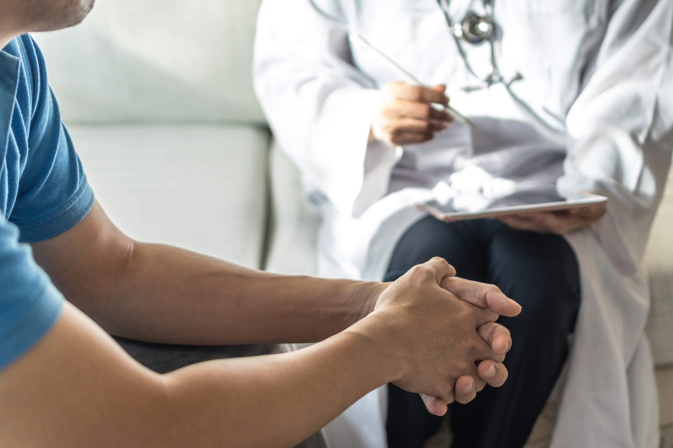 Men’s health disease, on prostate cancer or mental illness concept with male patient having consultation with doctor or psychiatrist working on diagnostic examination in medical clinic or hospital